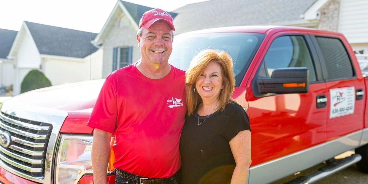 Roofing contractor consulting with homeowner